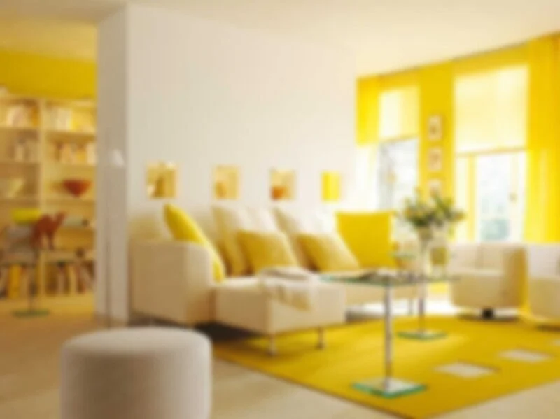 Sunny yellow living room with warm white walls and colorful accents, shown as room inspiration