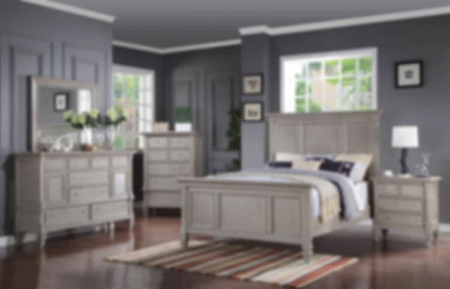 Bedroom with soft gray painted walls, white trim and a light-colored bed