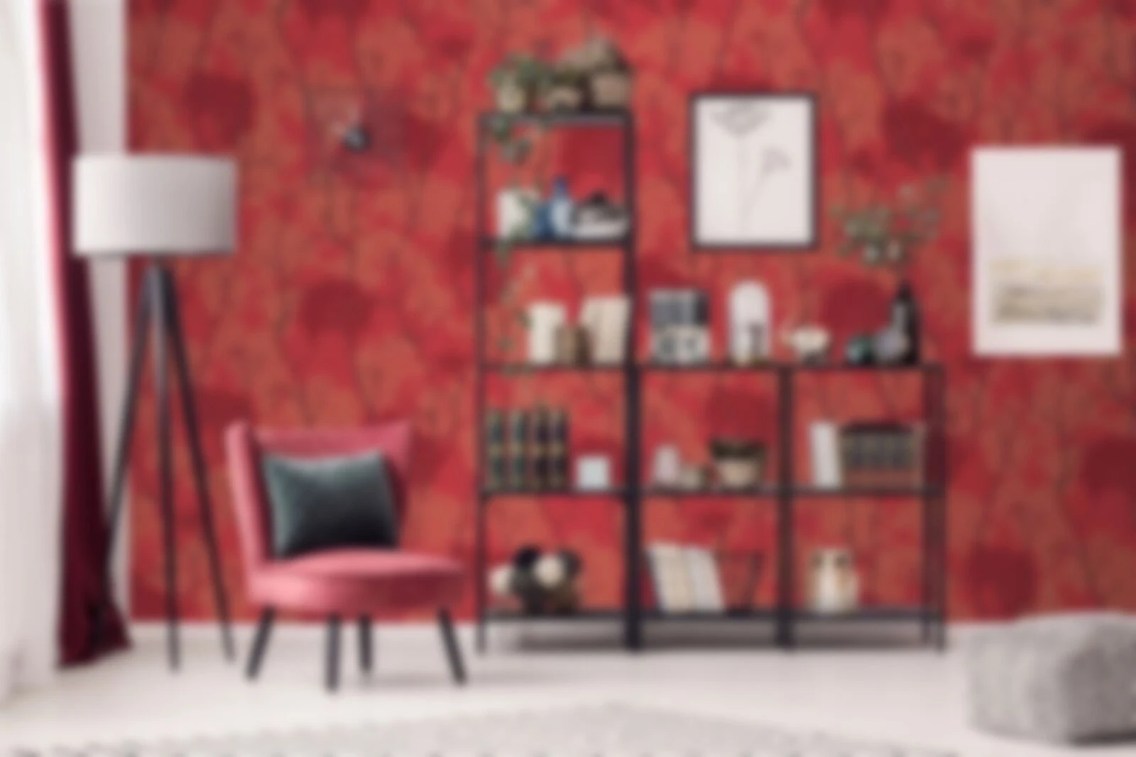 Room with a bold red patterned wall, accent chair and shelving